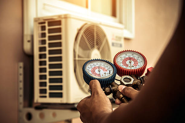 Professional Air Conditioning Service technician working in Cameron, MO
